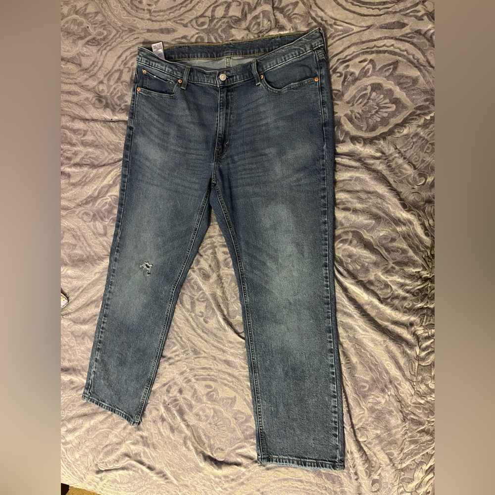 levi pants , lightly used , small rip